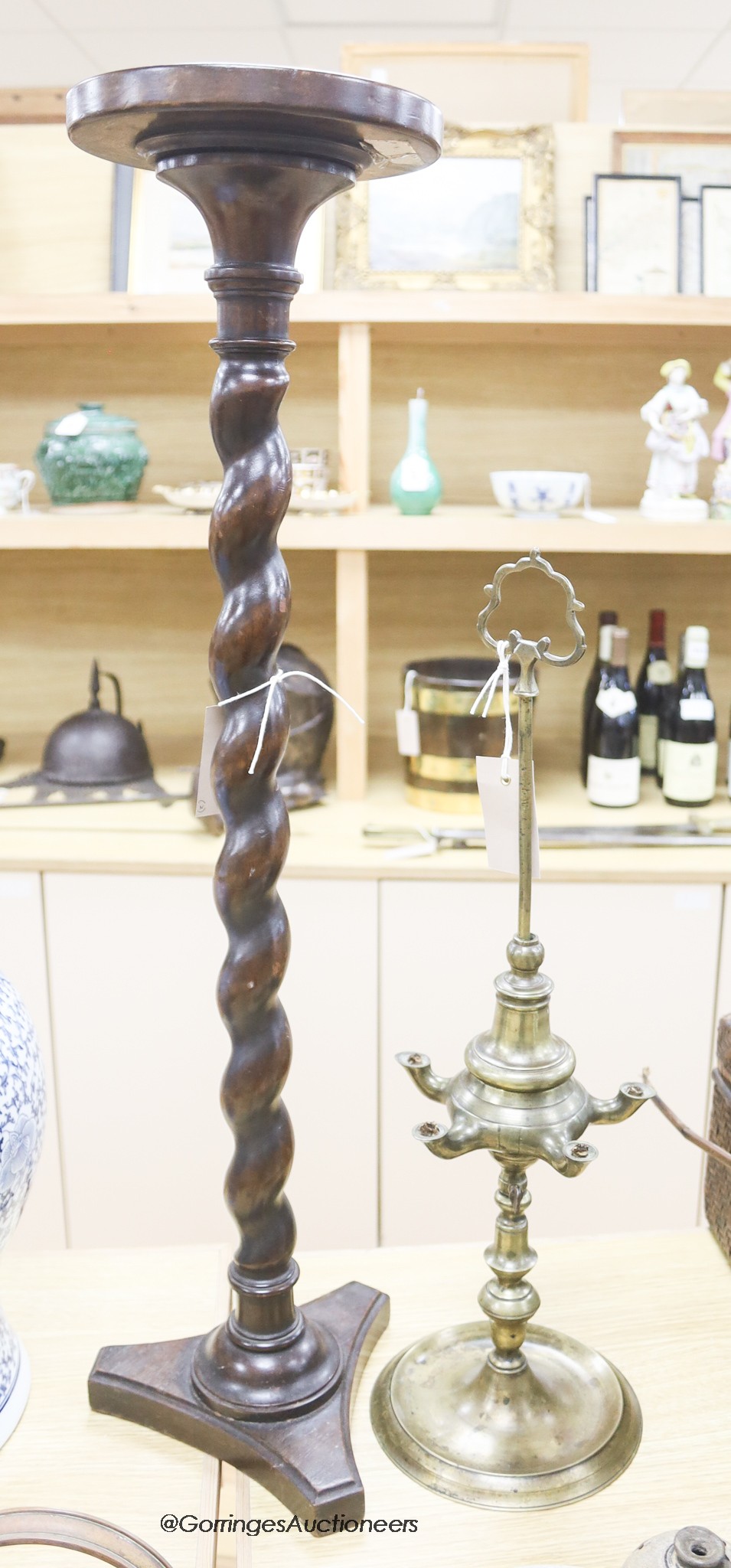 An 18th/19th century brass five light oil lamp and a lead-weighted mahogany barley-twist candlestand, tallest 77cm